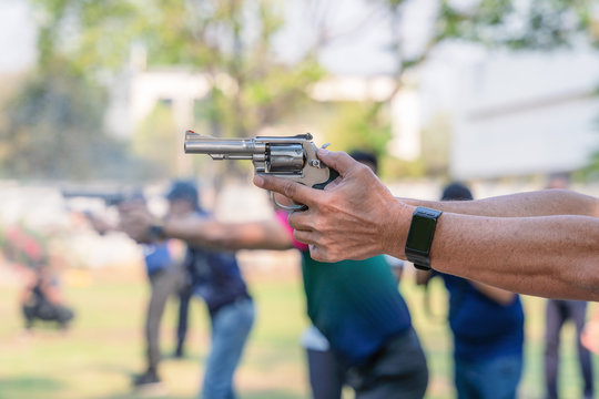 man hands holding and fire hand gun in gun shooting competition